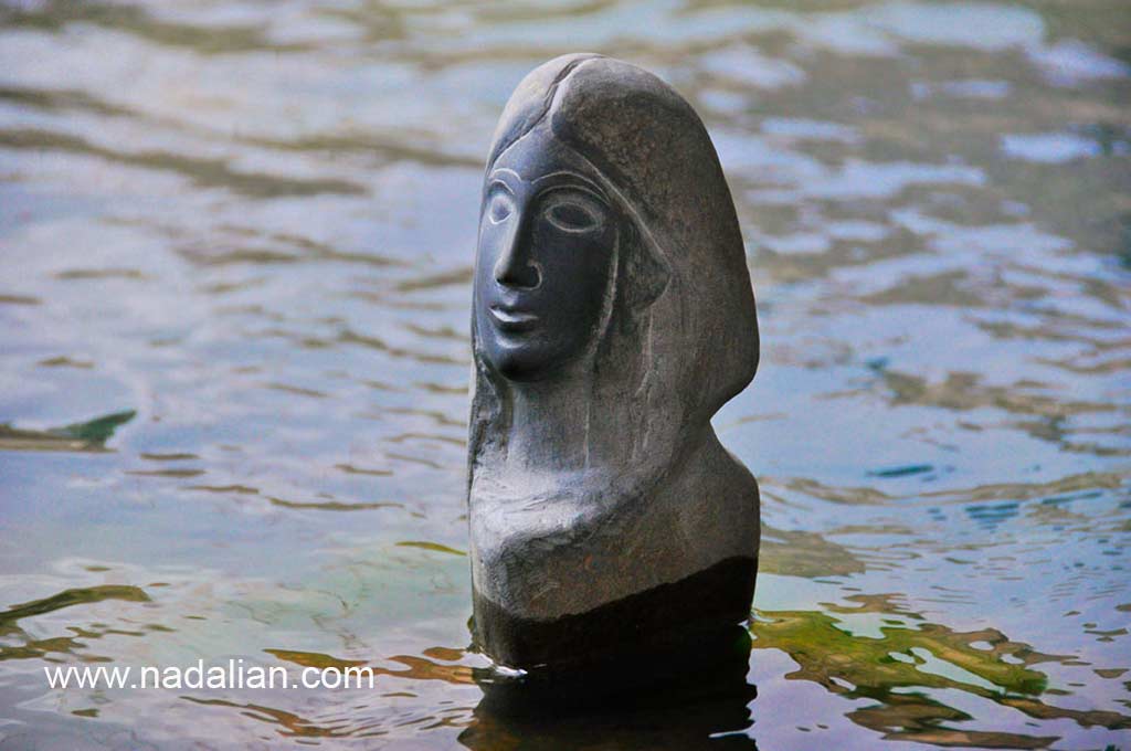 Ahmad Nadalian, sculptures, Stone, installed in river, Goddess of Water 