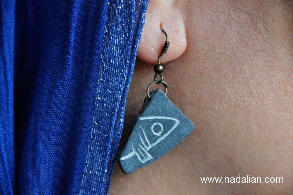 Stone earrings inspired by destroyed art works of Ahmad Nadalian in nature