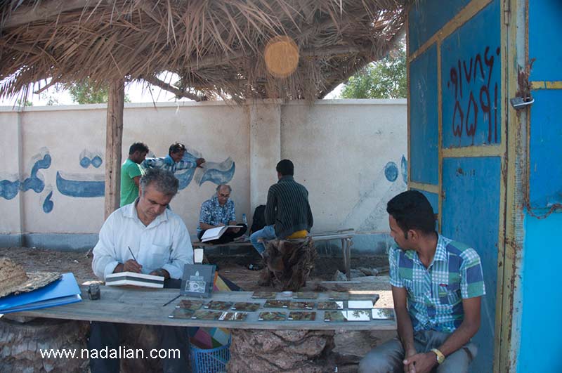 Ahmad Nadalian personally set up shop in port to sell art works of women.